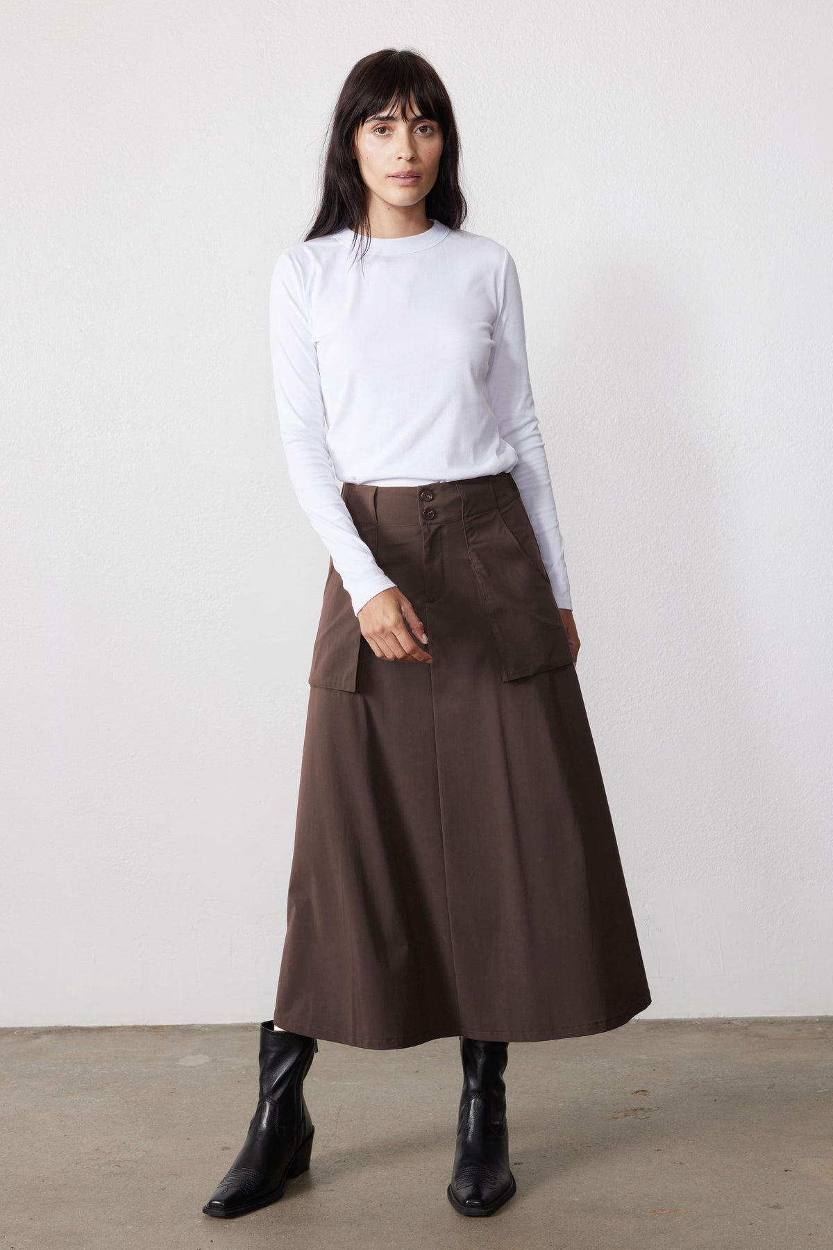 Brown utility midi skirt with flap pockets and buttoned waistband