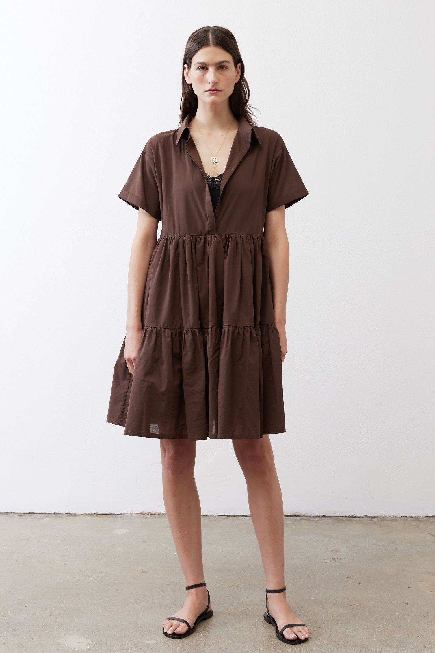 Dark brown poplin dress with short sleeves and tiered skirt, front view