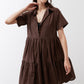 Dark brown poplin dress front with V-neck, short sleeves, and tiered skirt