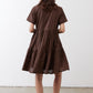 Brown tiered poplin dress back view with short sleeves and gathered waist