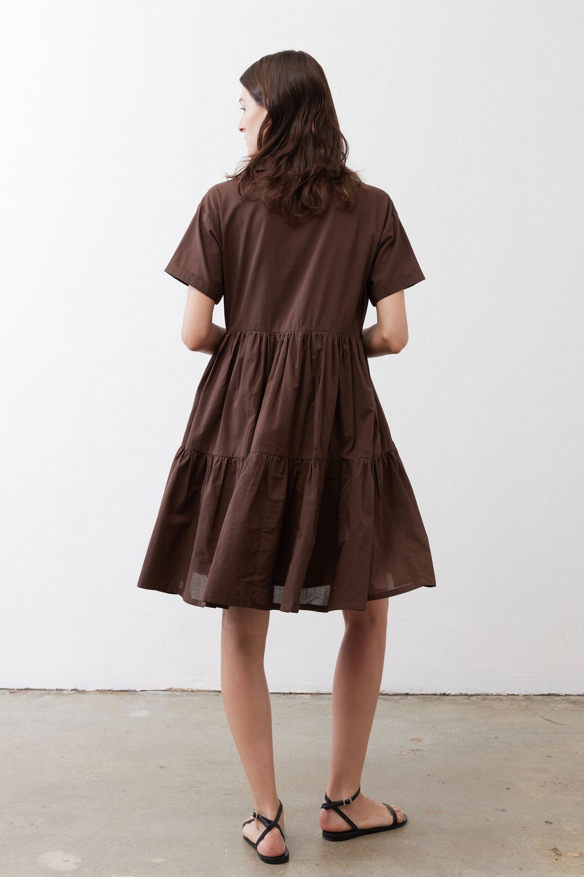 Brown poplin dress back view with tiered skirt and short sleeves