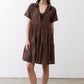 Dark brown poplin dress with buttoned V-neck and gathered tiered skirt