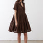 Dark brown V-neck poplin dress with short sleeves and layered tiered skirt