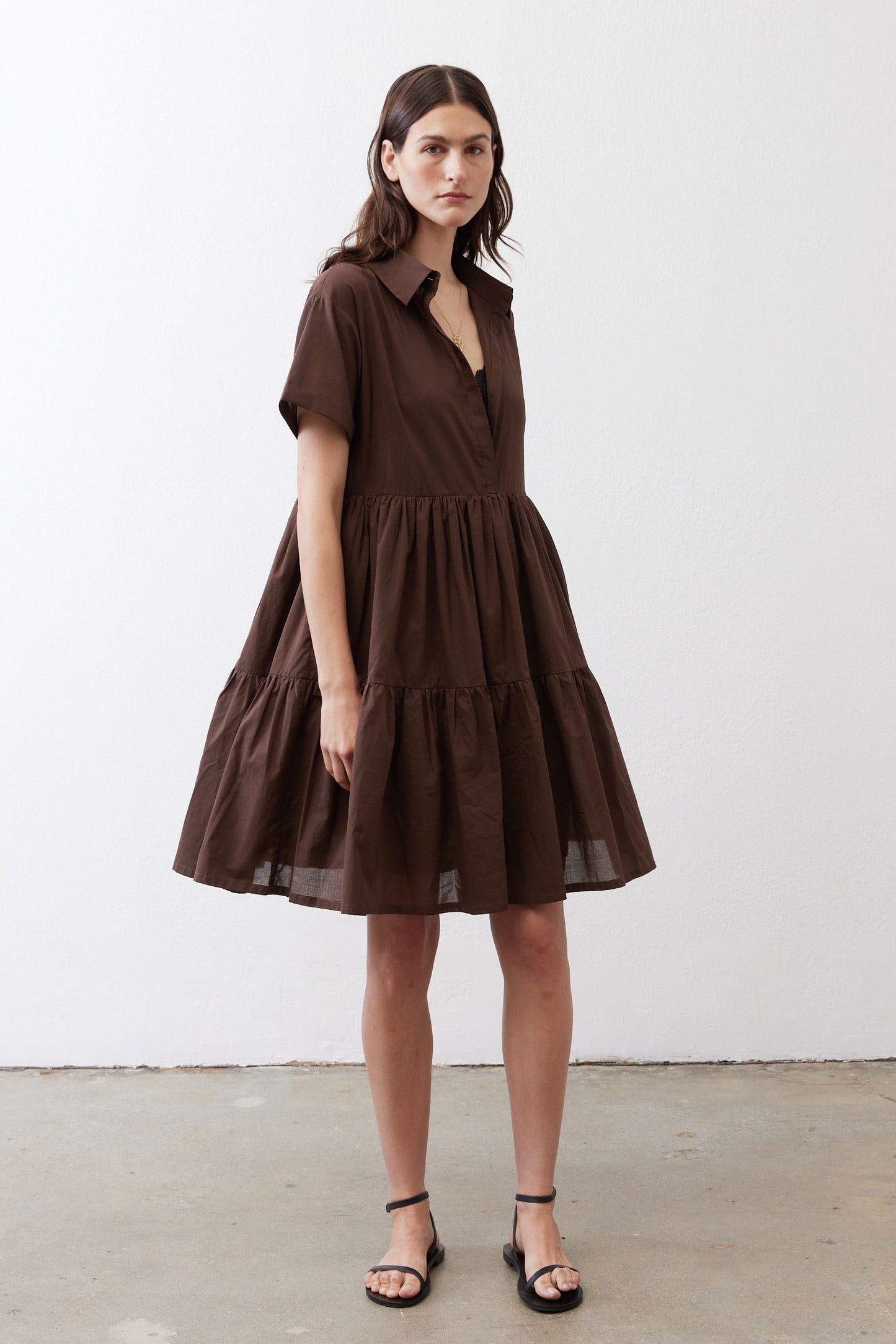 Dark brown V-neck poplin dress with short sleeves and layered tiered skirt