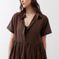 Brown poplin dress with open collar, short sleeves, and tiered ruffle hem