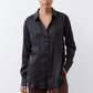 Black silk button-down top with pointed collar, button front, and long sleeves