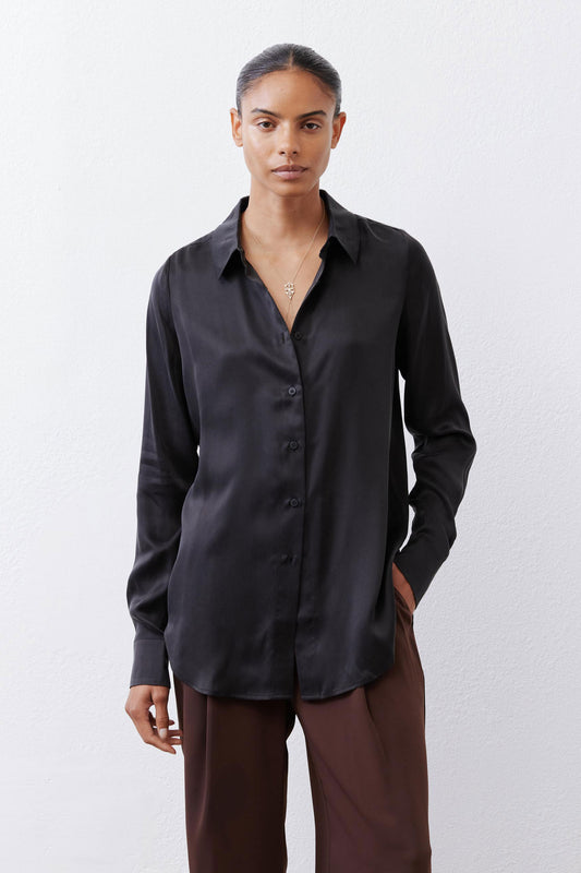Black silk button-down top with pointed collar, button front, and long sleeves