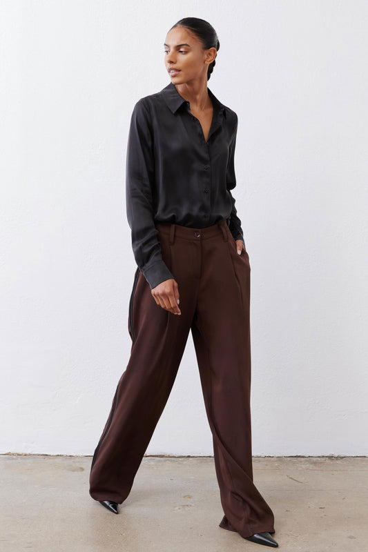 Black silk button-down top with pointed collar and button front, long sleeves