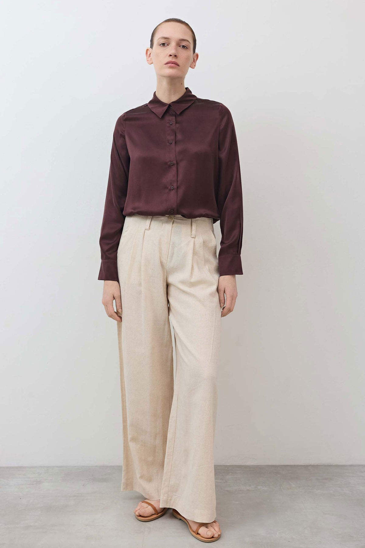 Dark plum silk button-down top with pointed collar and front buttons, long sleeves