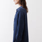 Dark blue silk button-down top side view with long sleeves and curved hem