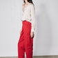 Peach blush silk button-down top with cuffs and front buttons, side view