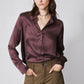 Deep plum silk button-down top with collar, long sleeves, and relaxed drape