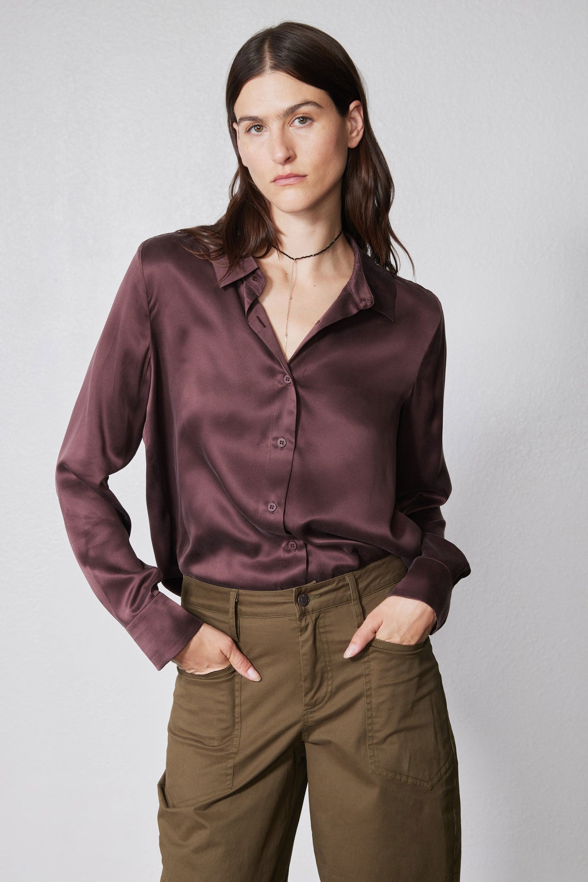 Deep plum silk button-down top with collar, long sleeves, and relaxed drape