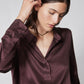 Silk button-down top in deep plum, long sleeves, collar, front button placket
