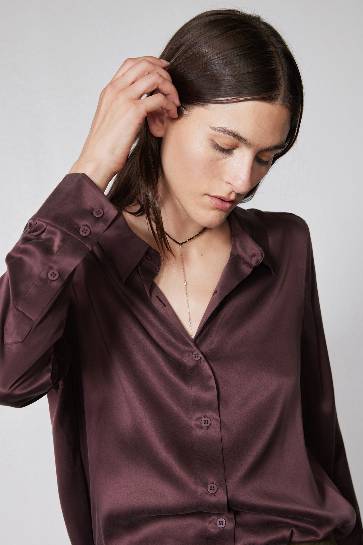Silk button-down top in deep plum, long sleeves, collar, front button placket