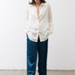 Ivory silk button-down top with long sleeves and open front placket