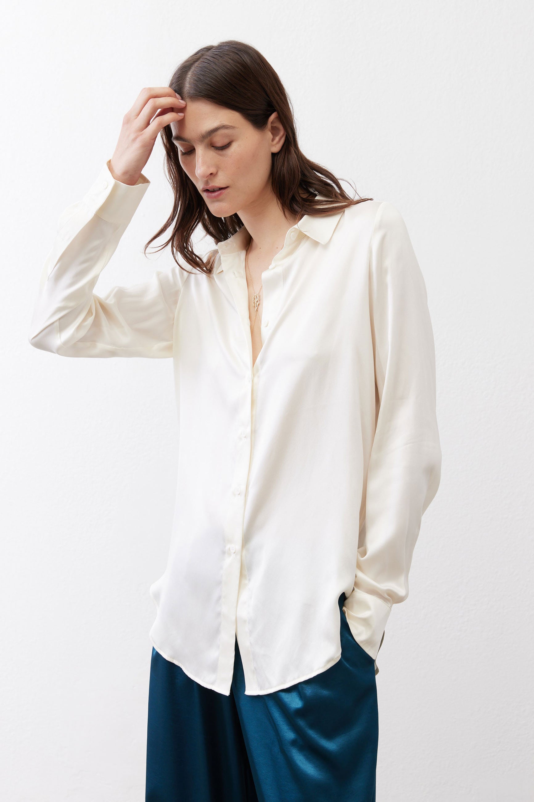 Ivory silk button-down top with stand collar and button front detail