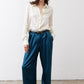 Ivory silk button-down top with pointed collar and smooth long sleeves