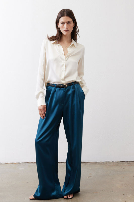Ivory silk button-down top with pointed collar and smooth long sleeves