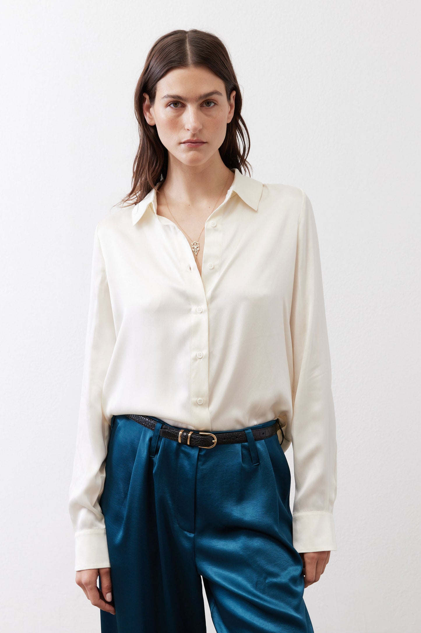 Ivory silk button-down top with pointed collar and button-front closure