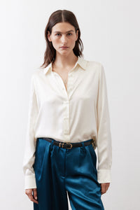 Ivory silk button-down top with pointed collar and button-front closure
