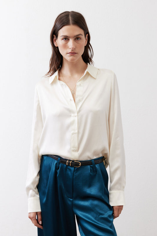 Ivory silk button-down top with pointed collar and button-front closure