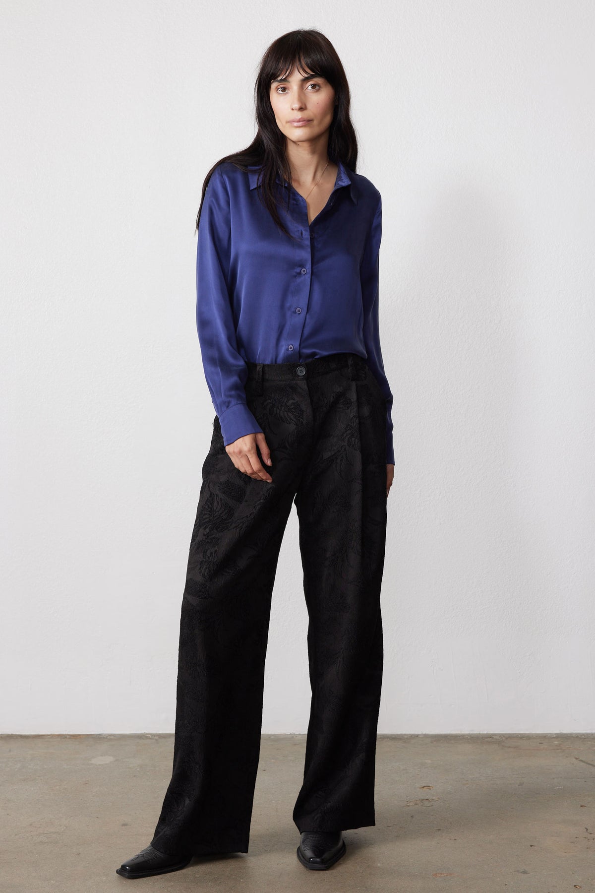 Blue washable silk button-down shirt with a relaxed fit, front buttons, and long sleeves.