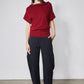 Wide-ish dark navy pants with elastic waist and wide straight legs