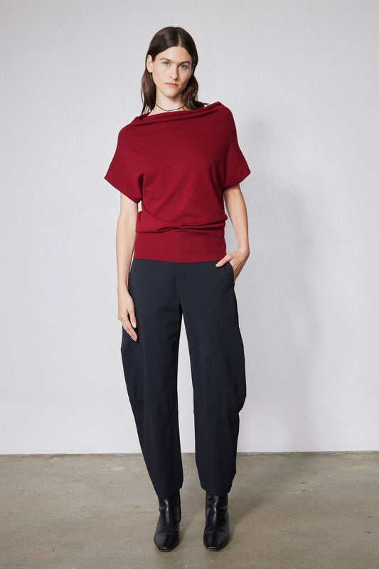 Wide-ish dark navy pants with elastic waist and wide straight legs