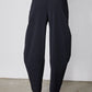Wide-ish dark navy pants, back view with center seam and relaxed wide legs