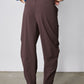 Coffee brown wide-leg pants with stitched pockets and elastic waist