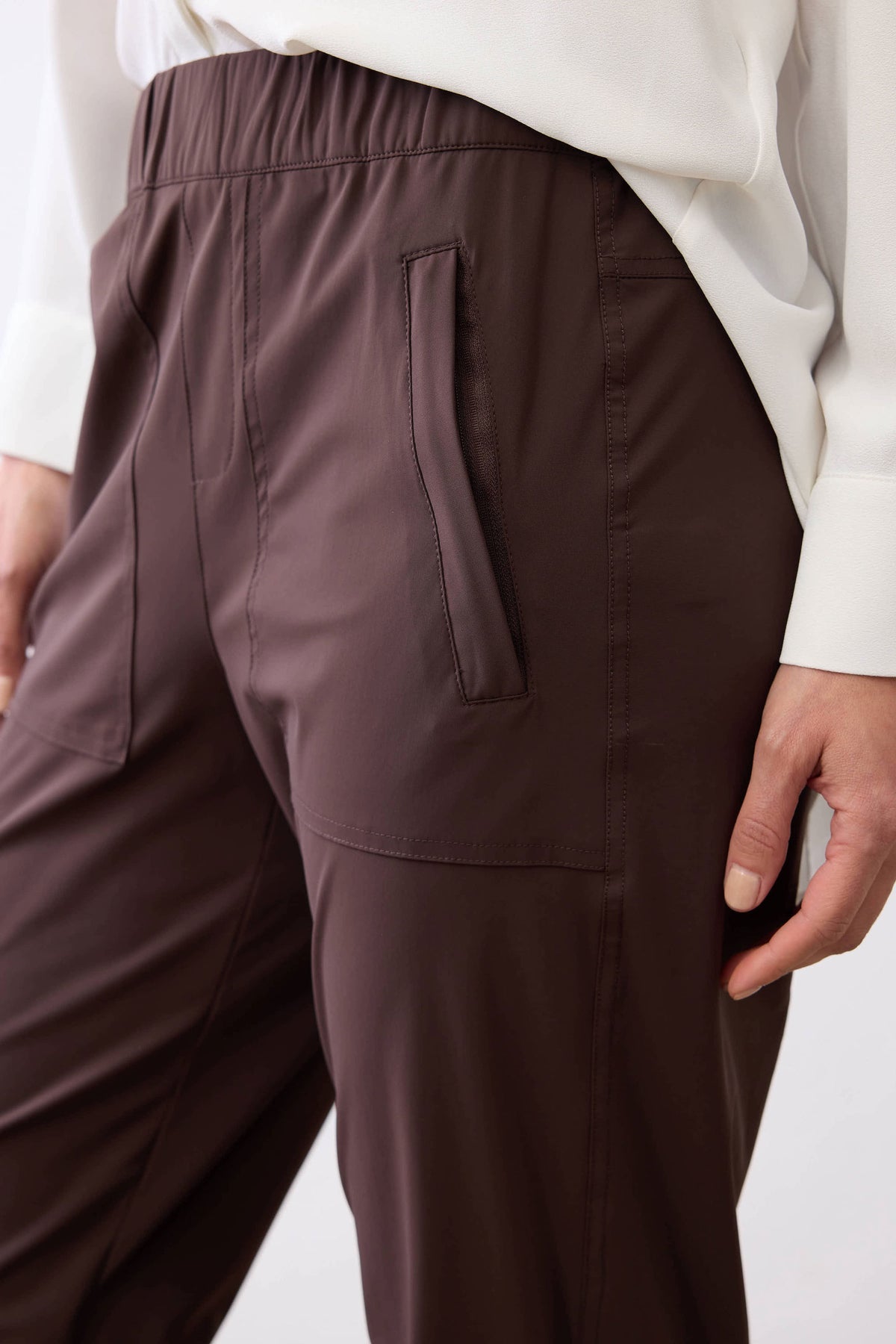 Coffee brown pants with back pocket and stitched panel detail