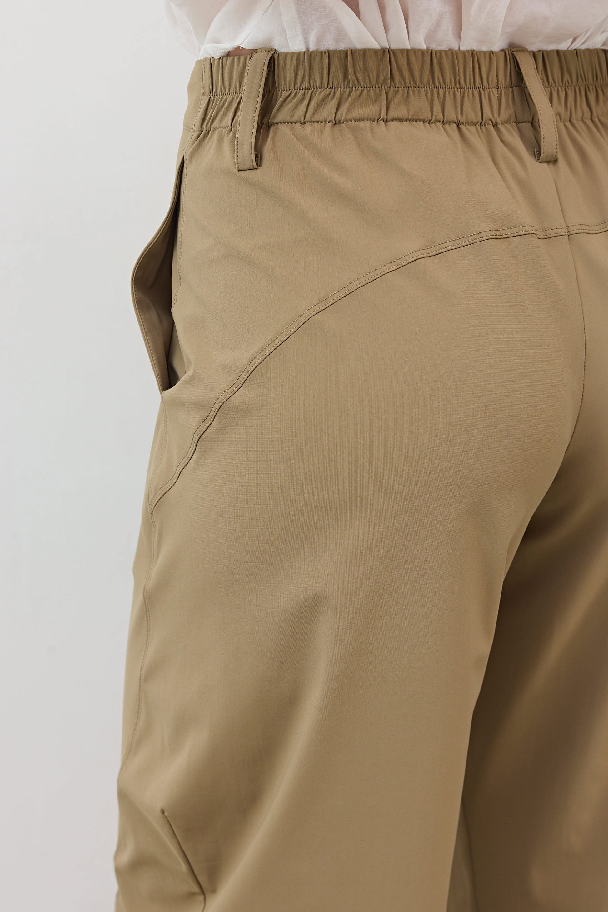 Dune wide-ish pants close-up of front pocket and curved seam detail