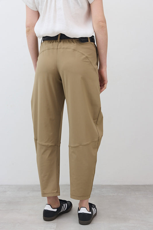Tan wide pants with relaxed tapered legs, back seam, and cuffed hem detail