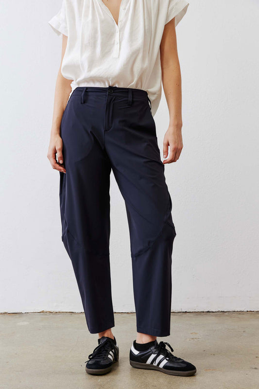 Dark navy wide-leg pants with center crease and ankle-length hem