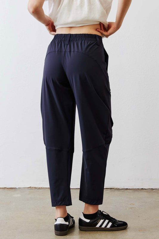 Dark navy wide-leg pants with elastic waistband and cargo pocket details