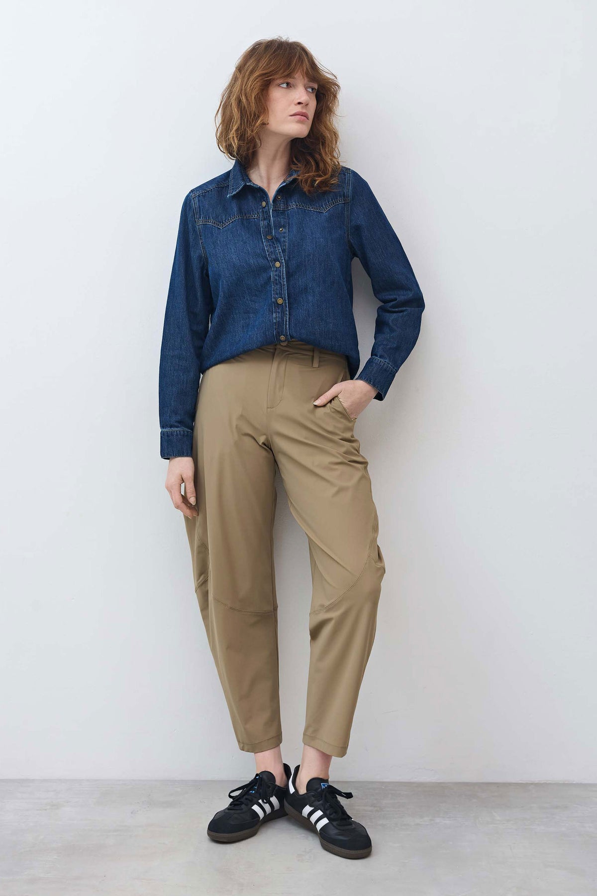 Dune tan wide-leg pants with buttoned waistband, belt loops, and ankle-length hem