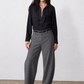 Gray pinstripe wide-leg suit pants, full length side-front view with belt and pockets