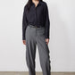 Gray pinstripe wide-leg suit pants with belt loops and cuffed hem, front view