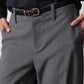 Gray pinstripe suit pants detail: front button, belt buckle, and side pockets