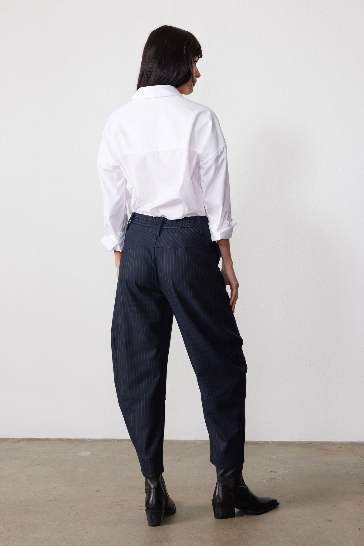 Navy gray pinstripe suit trousers with wide legs, high waist, belt loops, button fly