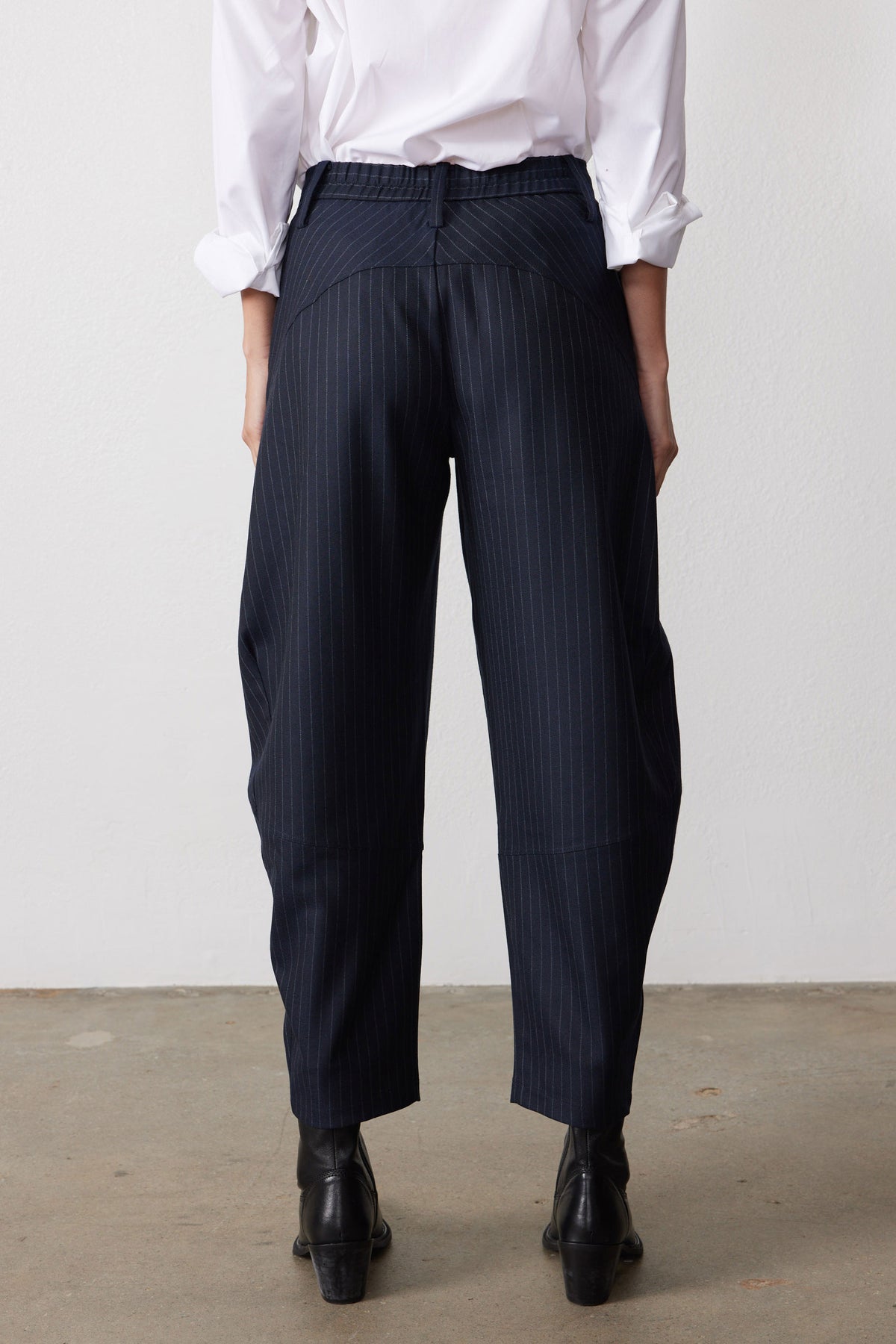 Navy gray pinstripe suit pants, front view with high waist and relaxed wide legs