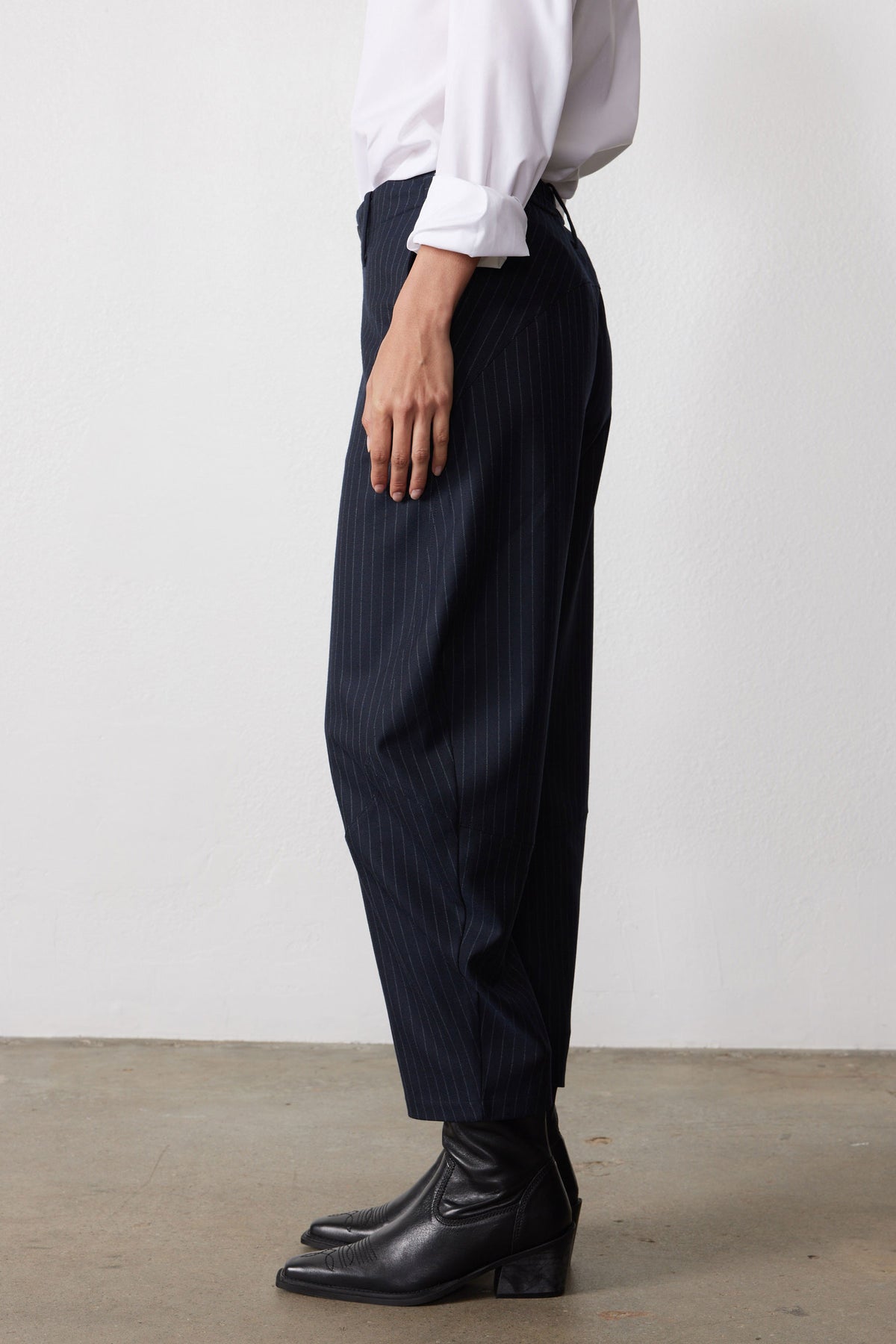 Navy gray pinstripe wide-leg suit trousers, side view with high waist and belt loops