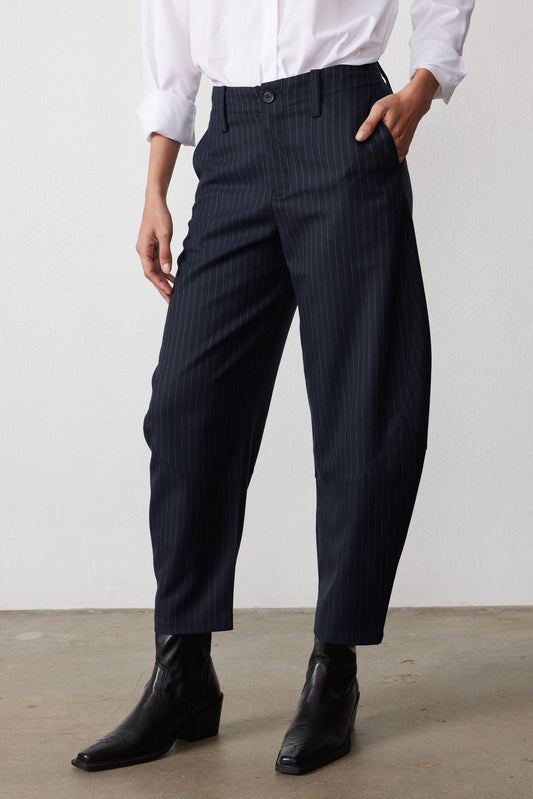 Navy gray pinstripe suit pants with wide straight legs, clean hems and button waistband