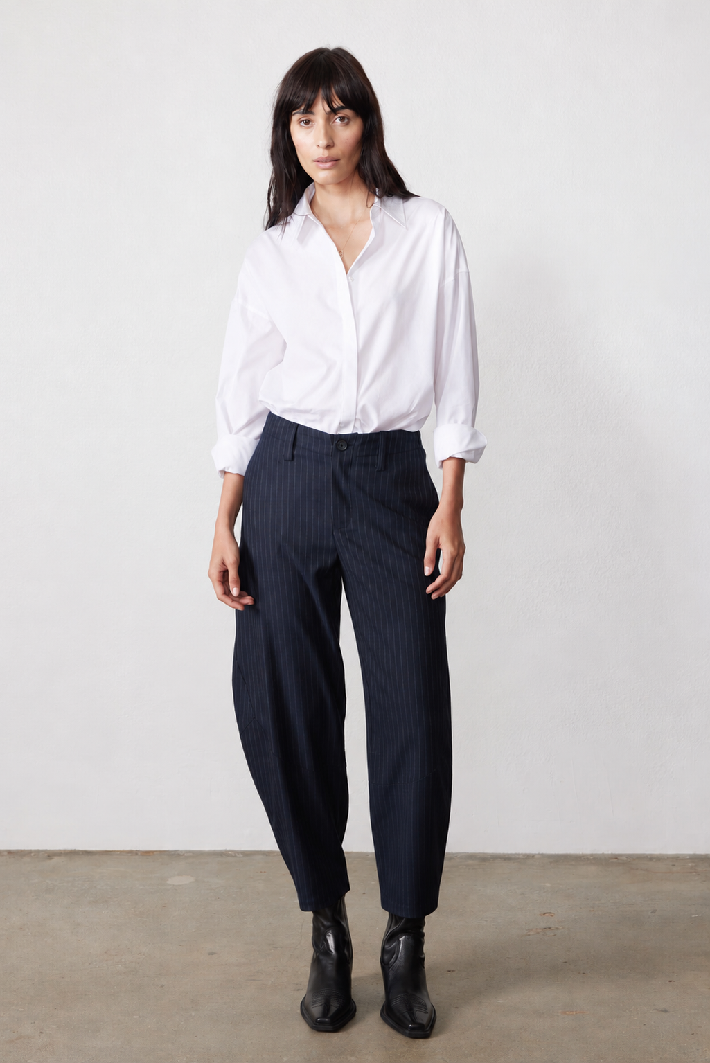 Navy gray pinstripe suit trousers with wide legs and high waist, belt loops and button front