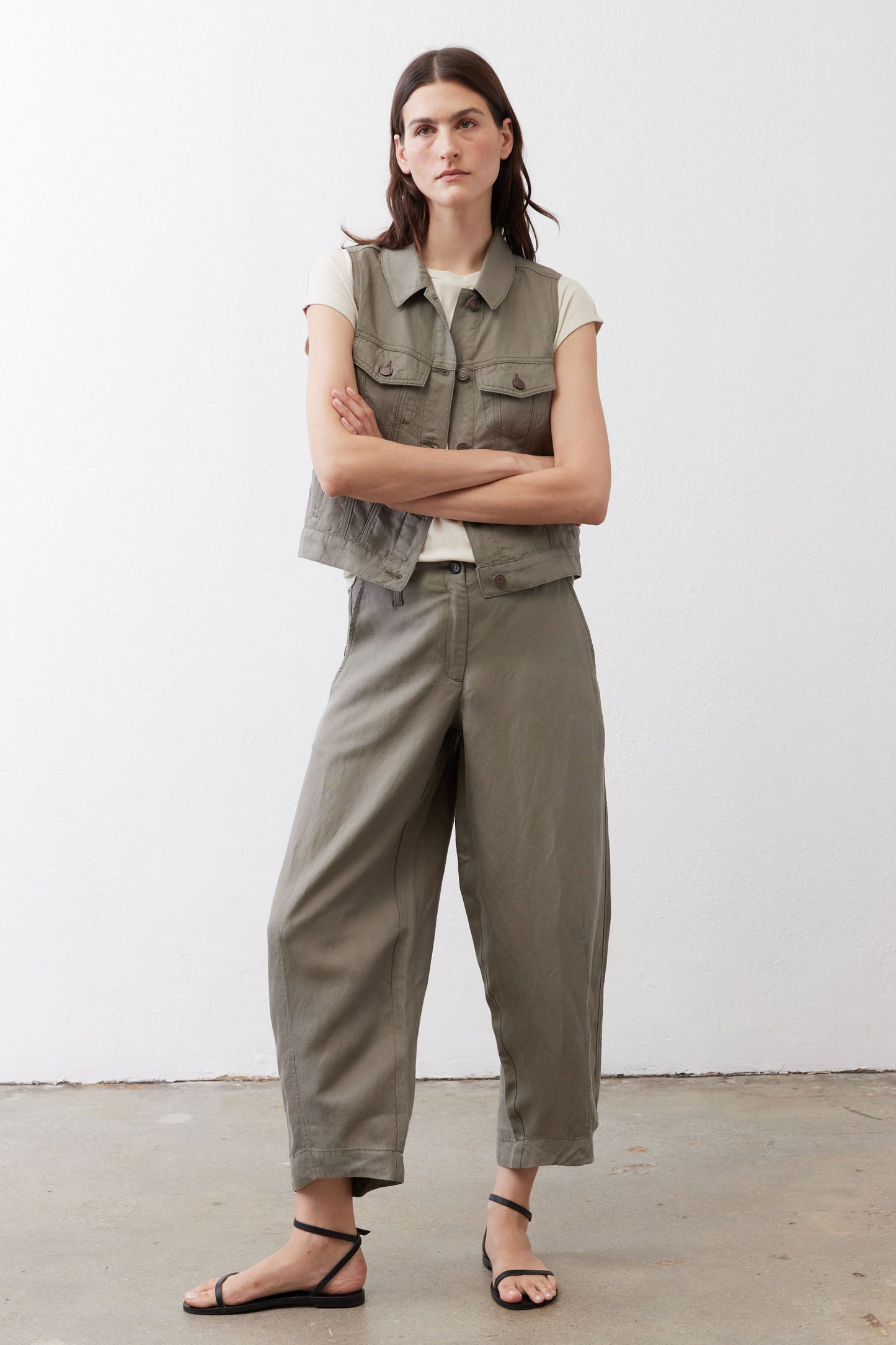 Wide-leg ankle pants in muted olive with front patch pockets and wide cropped legs