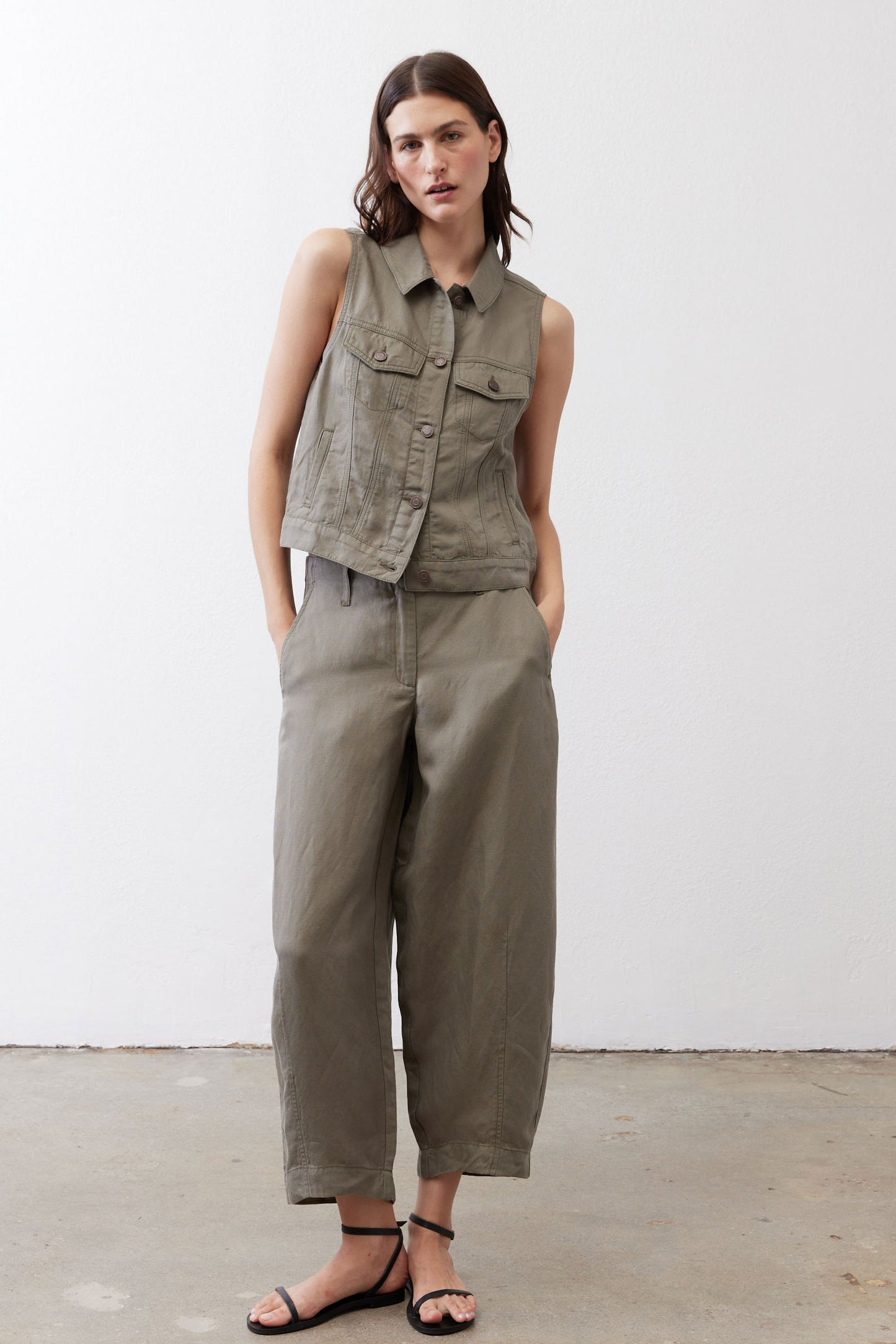 Wide-leg ankle pants in muted olive with front pockets and straight wide-leg shape