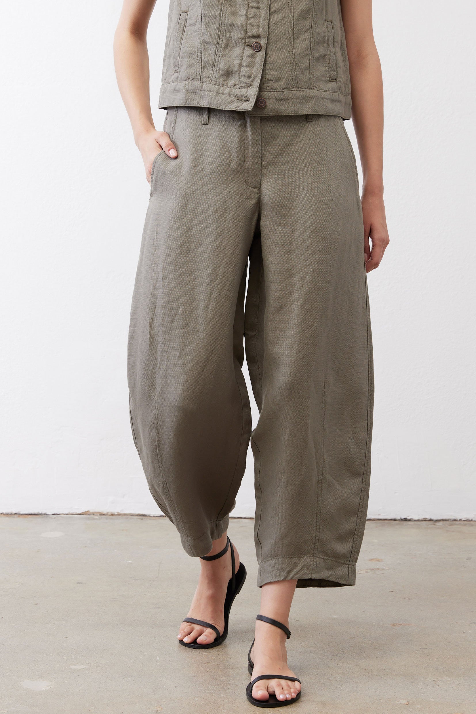 Wide-leg ankle pants in muted olive with button closure and wide cropped silhouette