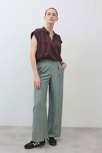 Belted wide-leg trousers in chinois green, side tie and relaxed straight legs