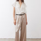 Champagne wide-leg trousers with elastic waistband and black belt detail